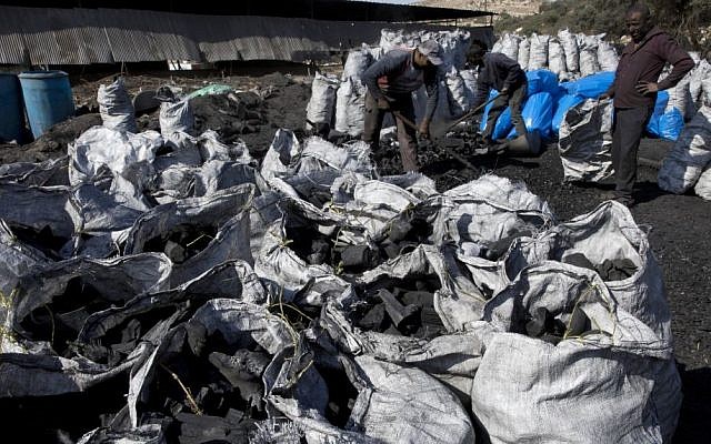 In this photo taken Monday, Nov. 21, 2016, Palestinian laborers work at the site of a charcoal factory, in the West Bank town of Yabad, near Jenin. (Nasser Nasser/AP) In this photo taken Monday, Nov. 21, 2016, Palestinian laborers work at the site of a charcoal factory, in the West Bank town of Yabad, near Jenin. (Nasser Nasser/AP)