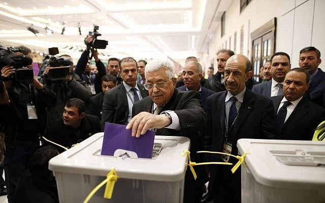 Palestinian Authority president Mahmud Abbas casts a vote at the Muqataa, the Palestinian Authority headquarters, in the city of Ramallah, West Bank, December 3, 2016. (Ahmad Gharabli/Pool photo via AP)