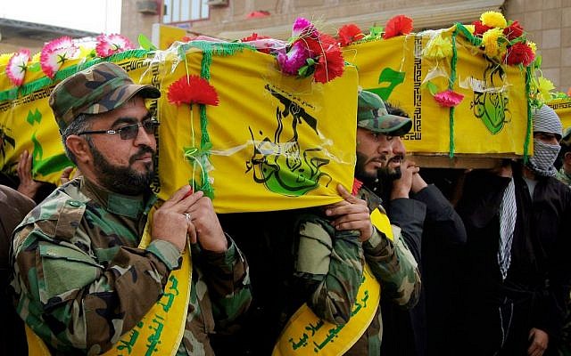  In this Tuesday, Dec. 29, 2015 file photo, mourners carry the coffins of four militia members of a Shiite group, Nujaba movement of Islamic Resistance, during their funeral procession in the Shiite holy city of Najaf, 100 miles (160 kilometers) south of Baghdad, Iraq. (AP Photo/Anmar Khalil, File)