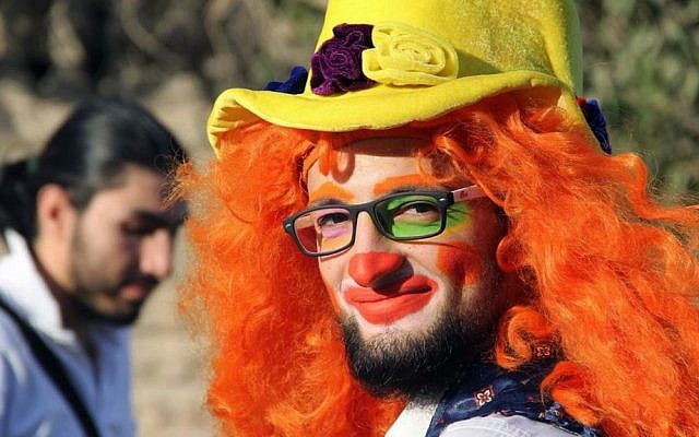 This undated photo shows Syrian social worker Anas al-Basha, 24, dressed as a clown, while posing for a photograph in Aleppo, Syria. (Courtesy of Ahmad al-Khatib, via AP) This undated photo shows Syrian social worker Anas al-Basha, 24, dressed as a clown, while posing for a photograph in Aleppo, Syria. (Courtesy of Ahmad al-Khatib, via AP)