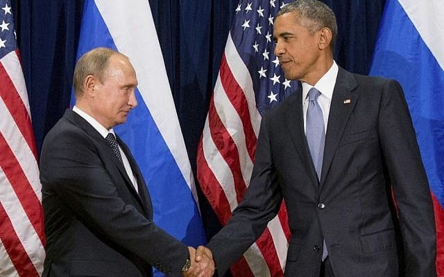  In this Sept. 28, 2015 file photo, President Barack Obama shakes hands with Russian President President Vladimir Putin before a bilateral meeting at United Nations headquarters. Obama has ordered intelligence officials to conduct a broad review on the election-season hacking that rattled the presidential campaign (AP Photo/Andrew Harnik, File)