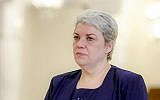In this photo taken May 20, 2015, Sevil Shhaideh, 52, stands at the Romanian presidency before being sworn in as regional development minister in Bucharest, Romania. (AP Photo/Octav Ganea)