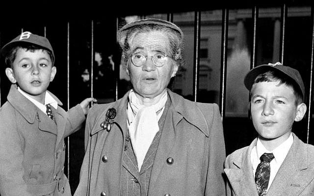 In this June 14, 1953 file photo, Sophie Rosenberg is shown with her grandsons Robert, 6, left, and Michael, 10, outside the White House in Washington, DC, during a demonstration seeking clemency for her son Julius and daughter-in-law Ethel Rosenberg. (AP Photo)