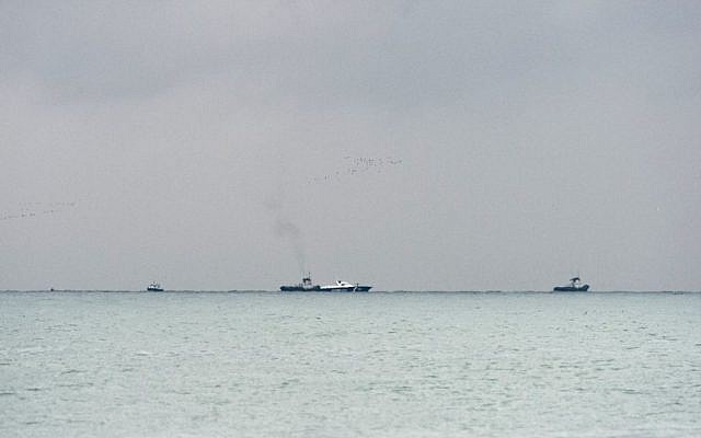 Russian rescue ships and boats search and collect wreckage from the crashed plane outside Sochi, Russia, December 25, 2016. (AP/Viktor Klyushin) 