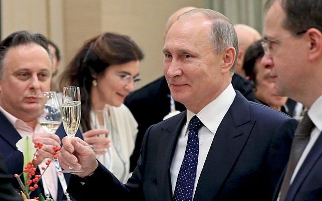 In this photo taken Friday, Dec. 2, 2016 Russian President Vladimir Putin toasts at a meeting with Russian and foreign cultural figures in the Mariinsky Theater in St. Petersburg, Russia. (Mikhail Klimentyev/Sputnik, Kremlin Pool Photo via AP) In this photo taken Friday, Dec. 2, 2016 Russian President Vladimir Putin toasts at a meeting with Russian and foreign cultural figures in the Mariinsky Theater in St. Petersburg, Russia. (Mikhail Klimentyev/Sputnik, Kremlin Pool Photo via AP)