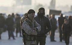 Armed Syrian fighters evacuated from the embattled Syrian city of Aleppo during a ceasefire arrive at a refugee camp in Rashidin, near Idlib, Syria, December 20, 2016. (AP)