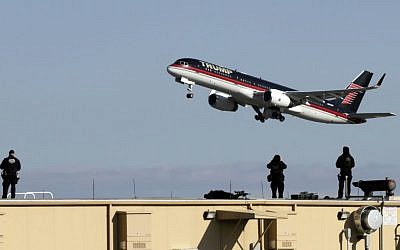President-elect Donald Trump's plane leaves La Guardia Airport, in New York, Thursday, Dec. 1, 2016. (AP Photo/Richard Drew)
