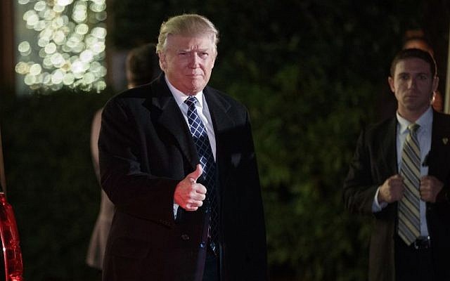 President-elect Donald Trump gestures toward reporters as he arrives for a party at the home of Robert Mercer, one of his biggest campaign donors, December 3, 2016, in Head of the Harbor, N.Y. (AP Photo/Evan Vucci) President-elect Donald Trump gestures toward reporters as he arrives for a party at the home of Robert Mercer, one of his biggest campaign donors, December 3, 2016, in Head of the Harbor, N.Y. (AP Photo/Evan Vucci)