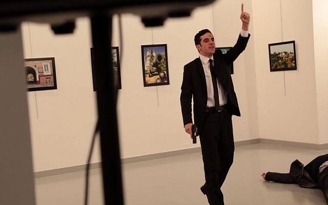 A man gestures near to Andrei Karlov on ground, the Russian Ambassador to Turkey at a photo gallery in Ankara, Turkey, December 19, 2016. (AP Photo/Burhan Ozbilici) A man gestures near to Andrei Karlov on ground, the Russian Ambassador to Turkey at a photo gallery in Ankara, Turkey, December 19, 2016. (AP Photo/Burhan Ozbilici)