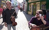 Daniel Hoffman (left) playing with local band The Rascals on the streets of Galway, Ireland (Courtesy Daniel Hoffman)
