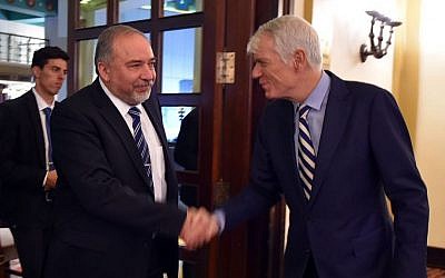 Defense Minister Avigdor Liberman (left) shakes hands with EU ambassador Lars Faaborg Anderson during a meeting on December 7, 2016. (Ariel Hermoni/Defense Ministry)