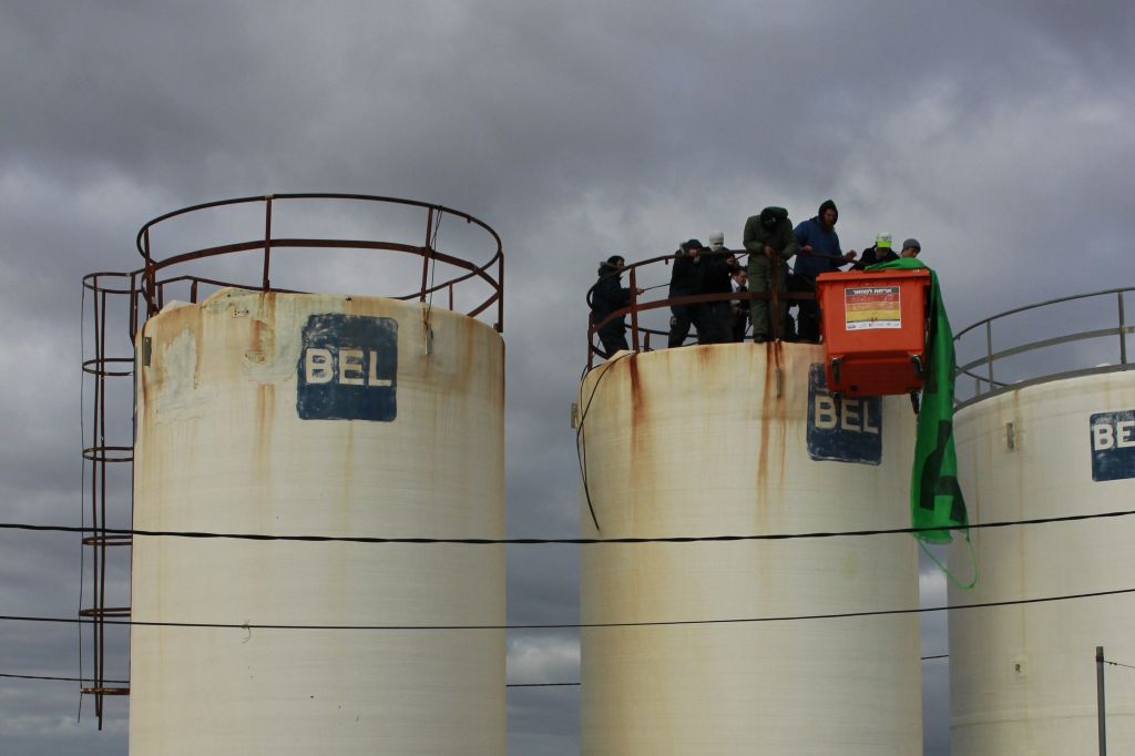 Protesters gather atop a water tower in Amona on December 15, 2016. (Judah Ari Gross/ Times of Israel) Protesters gather atop a water tower in Amona on December 15, 2016. (Judah Ari Gross/ Times of Israel)