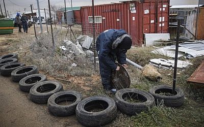 Jewish youth preparing to resist the evacuation of Amona, an illegal settler outpost in the West Bank, on December 15, 2016. Photo by Yonatan Sindel/Flash90 A Jewish youth preparing to resist the evacuation of Amona, an illegal settler outpost in the West Bank, on December 15, 2016. (Yonatan Sindel/Flash90)