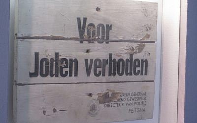A 'Jews forbidden' sign from war-era Amsterdam, displayed in the Dutch Theater from which thousands of Jews were gathered before deportation, April 2012 (Matt Lebovic/The Times of Israel) A 'Jews forbidden' sign from war-era Amsterdam, displayed in the Dutch Theater from which thousands of Jews were gathered before deportation, April 2012 (Matt Lebovic/The Times of Israel)