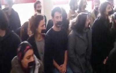 Students at Bezalel Academy of Art and Design in Jerusalem hold a sit-in with their mouths taped shut on December 14, 2016, to protest censorship following a row over images of Prime Minister Benjamin Netanyahu produced at the school (screen capture/ Channel 2)