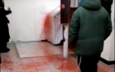 Blood-like paint splattered at the grave-site of Rabbi Nachman of Bratslav in Uman, Ukraine, December 21, 2016. (screen capture: YouTube/YWN)