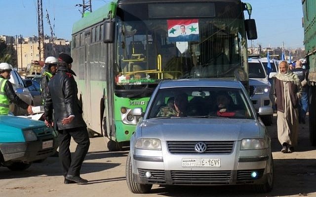 A bus is seen in the embattled city of Aleppo during an evacuation operation of rebel fighters and their families from rebel-held areas on December 15, 2016.
/ AFP PHOTO / STRINGER A bus is seen in the embattled city of Aleppo during an evacuation operation of rebel fighters and their families from rebel-held areas on December 15, 2016.
/ AFP PHOTO / STRINGER