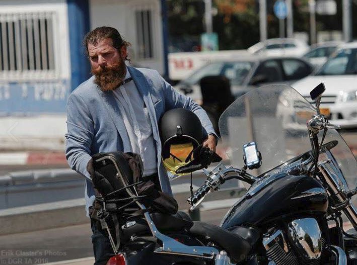 Erik Claster, and one of vintage motorcycles, one of his many hobbies (Courtesy Erik Claster)