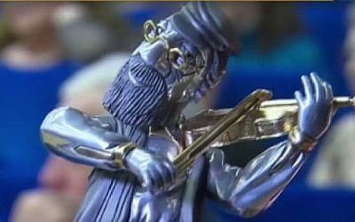 An illustrative photo of a 'Fiddler on the Roof' award for individuals who make exceptional contributions to Russian Jewry, held annually. (Screenshot)