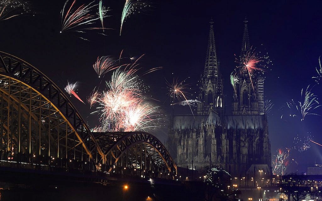 Fireworks exploding over the Rhine River during a New Year’s party in Cologne, Germany, January 1, 2014. (Patrik Stollarz/AFP/Getty Images) Fireworks exploding over the Rhine River during a New Year’s party in Cologne, Germany, January 1, 2014. (Patrik Stollarz/AFP/Getty Images)