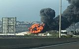 Illustrative: A blaze and toxic smoke clouds at the Bazan Group's Haifa oil refinery on December 25, 2016. (Israel Police)