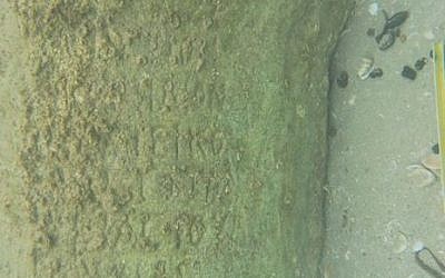 An inscription bearing the name of a previously unknown Roman ruler of Judea was discovered off Tel Dor by the University of Haifa, in January 2016. It is shown here before it was excavated. (Courtesy of the University of Haifa)