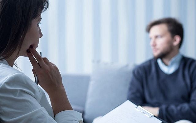 Illustrative photo of a psychologist talking to a patient (KatarzynaBialasiewicz/Getty Images)