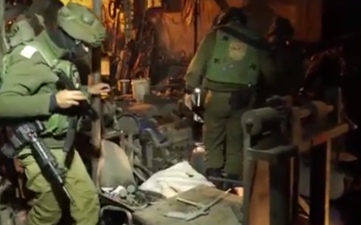 IDF soldiers during a raid of an illegal gun workshop in the West Bank city of Hebron on Monday, December 19, 2016. (Screen capture: IDF Facebook) IDF soldiers during a raid of an illegal gun workshop in the West Bank city of Hebron on Monday, December 19, 2016. (Screen capture: IDF Facebook)