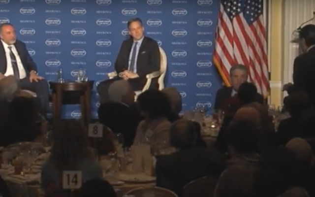 Haim Saban (back to camera) stands to make a point at the Saban Forum, December 2, 2016 (Courtesy)