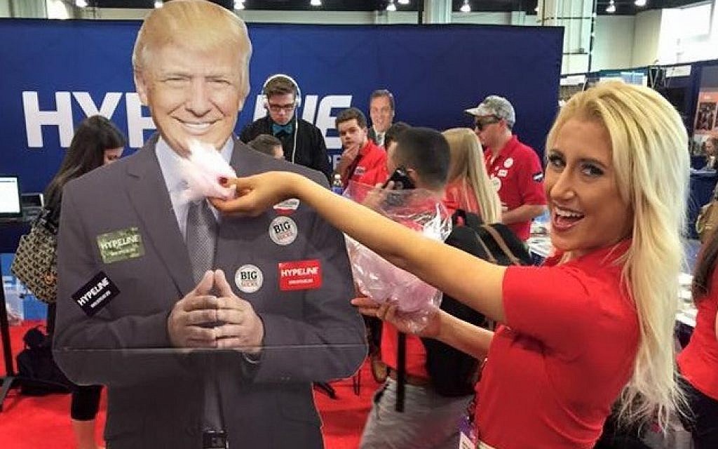 Sophia Witt, a political communications major at Kent State University, 'feeds' her candidate at a rally. (courtesy) Sophia Witt, a political communications major at Kent State University, 'feeds' her candidate at a rally. (courtesy)