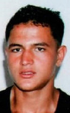 This undated picture provided by Najoua Amri on Thursday, Dec. 22, 2016, shows Anis Amri, the fugitive Tunisian extremist suspected in Berlin's deadly Christmas market attack, posing at his parents' house in Oueslatia, central Tunisia. (Courtesy Najoua Amri to AP) This undated picture provided by Najoua Amri on Thursday, Dec. 22, 2016, shows Anis Amri, the fugitive Tunisian extremist suspected in Berlin's deadly Christmas market attack, posing at his parents' house in Oueslatia, central Tunisia. (Courtesy Najoua Amri to AP)