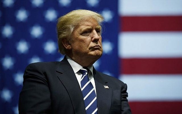 President-elect Donald Trump looks on during a rally at the DeltaPlex Arena, December 9, 2016, in Grand Rapids, Michigan. (Drew Angerer/Getty Images/AFP)