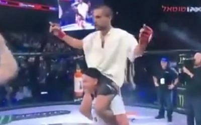 Elazar Tariku celebrates his victory after an MMA fight, November 30, 2016. (Screenshot)