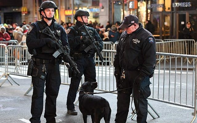 New York City police officers stand guard in Times Square on December 31, 2016. (Angela Weiss/AFP) New York City police officers stand guard in Times Square on December 31, 2016. (Angela Weiss/AFP)