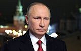 Russian President Vladimir Putin makes his New Year's address to the nation from the Kremlin in Moscow on December 31, 2016. (AFP/Sputnik/Mikhail Klimentiev)