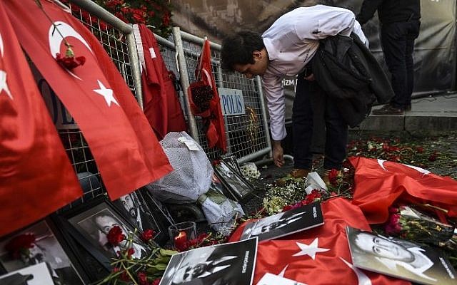 Pictures of victims of the New Year's Day attack on an Istanbul nightclub lie on Turkish national flags and flowers in front of the Reina nightclub on January 3, 2017 in Istanbul. (AFP Photo/Bulent Kilic) Pictures of victims of the New Year's Day attack on an Istanbul nightclub lie on Turkish national flags and flowers in front of the Reina nightclub on January 3, 2017 in Istanbul. (AFP Photo/Bulent Kilic)