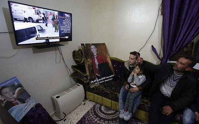 Yusri the father of Abdul Fatah al-Sharif watches on television the verdict of the trial of Israeli soldier Elor Azaria who killed their son, at their family home in the West Bank town of Hebron on January 4, 2017. AFP/HAZEM BADER) Yusri the father of Abdul Fatah al-Sharif watches on television the verdict of the trial of Israeli soldier Elor Azaria who killed their son, at their family home in the West Bank town of Hebron on January 4, 2017. AFP/HAZEM BADER)