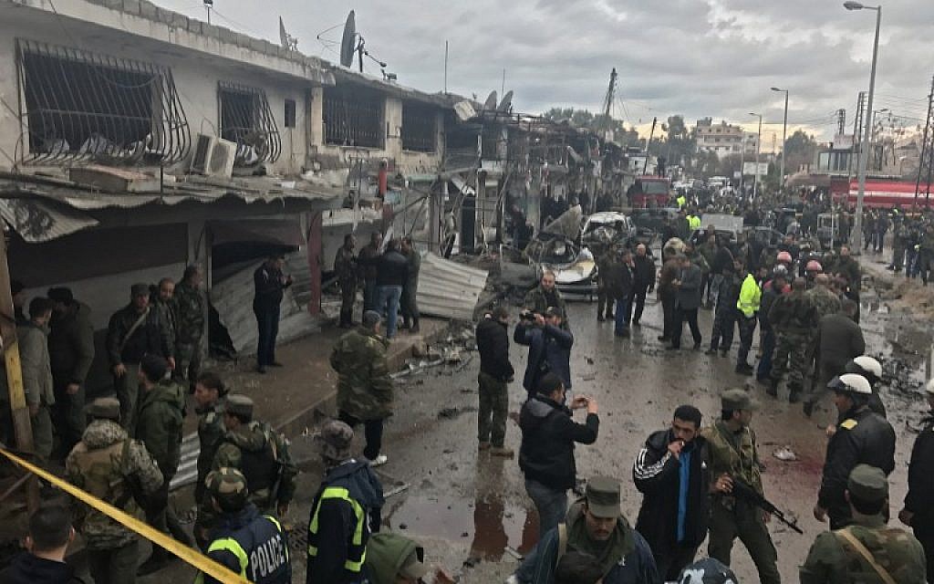 Syrians gather at the site of a car bomb explosion in Syria's coastal city of Jablah, a bastion of the regime, on January 5, 2017. (AFP/STRINGER)