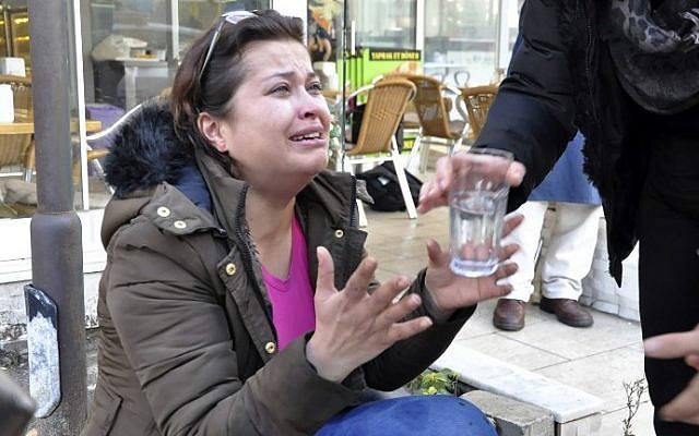 A woman reacts as she is given a glass of water near the scene of a car bomb outside the courthouse in Aegean coastal city of Izmir on January 5, 2017. (AFP PHOTO / IHA AND IHLAS NEWS AGENCY) A woman reacts as she is given a glass of water near the scene of a car bomb outside the courthouse in Aegean coastal city of Izmir on January 5, 2017. (AFP PHOTO / IHA AND IHLAS NEWS AGENCY)