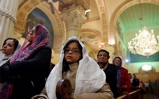 Coptic Orthodox Christians attend a Christmas eve mass at Virgin Mary Church in Road El Farag district, in Cairo, Egypt on January 6, 2017. (AFP PHOTO / MOHAMED EL-SHAHED) Coptic Orthodox Christians attend a Christmas eve mass at Virgin Mary Church in Road El Farag district, in Cairo, Egypt on January 6, 2017. (AFP PHOTO / MOHAMED EL-SHAHED)