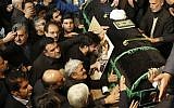 Mourners gather around the coffin of former Iranian president Akbar Hashemi Rafsanjani during a mourning ceremony at the Jamaran mosque in Tehran, on January 9, 2017. (AFP PHOTO / ATTA KENARE)