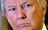 President-elect Donald Trump speaks to reporters in the lobby of Trump Tower in New York City, January 9, 2017. (Drew Angerer/Getty Images/AFP)