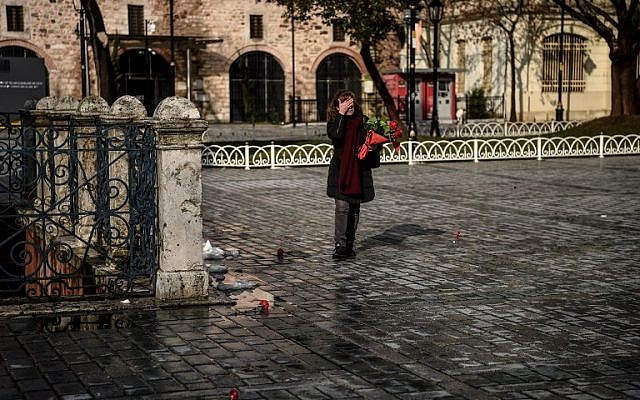 Sibel Satiroglu, a tour guide places red carnations Sultanahmet Square, the site where 12 of her German clients were killed last year in a bombing, in Istanbul on January 12, 2017.(AFP PHOTO / OZAN KOSE) Sibel Satiroglu, a tour guide places red carnations Sultanahmet Square, the site where 12 of her German clients were killed last year in a bombing, in Istanbul on January 12, 2017.(AFP PHOTO / OZAN KOSE)
