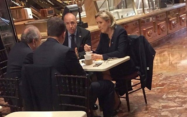 This picture distributed courtesy of the US President elect transition pool reporter Samuel Levine shows far-right French presidential candidate Marine Le Pen (R) when spotted at Donald Trump's New York headquarters building on January 12, 2017 having coffee at Trump Ice Cream Parlor on the ground floor of Trump Tower, with three men including her partner Louis Aliot (2nd R). (AFP/HUFFINGTON POST/TRANSITION POOL / Samuel LEVINE) This picture distributed courtesy of the US President elect transition pool reporter Samuel Levine shows far-right French presidential candidate Marine Le Pen (R) when spotted at Donald Trump's New York headquarters building on January 12, 2017 having coffee at Trump Ice Cream Parlor on the ground floor of Trump Tower, with three men including her partner Louis Aliot (2nd R). (AFP/HUFFINGTON POST/TRANSITION POOL / Samuel LEVINE)