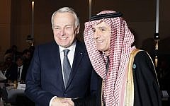 French Minister of Foreign Affairs Jean-Marc Ayrault (L)  shakes hands with Saudi Foreign Minister Adel al-Jubeir during the opening of the Mideast peace conference in Paris on January 15, 2017. (AFP PHOTO / POOL / THOMAS SAMSON)