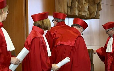 The President of Germany's Constitutional Court Andreas Vosskuhle and his judges leave the room after proclaiming their verdict on a possible ban of Germany's right-extremist NPD party at the Federal Constitutional Court in Karlsruhe, southwestern Germany, on January 17, 2017. (AFP/POOL/KAI PFAFFENBACH)