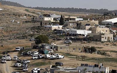 Israeli police (foreground) gather in the unreocgnized Bedouin village of Umm al-Hiran in the Negev desert. (AFP Photo/Menahem Kahana)