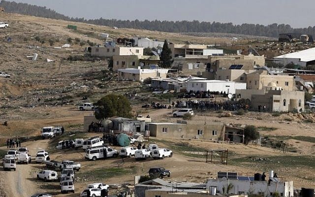 Israeli police (foreground) gather in the unreocgnized Bedouin village of Umm al-Hiran in the Negev desert. (AFP Photo/Menahem Kahana) Israeli police (foreground) gather in the unreocgnized Bedouin village of Umm al-Hiran in the Negev desert. (AFP Photo/Menahem Kahana)