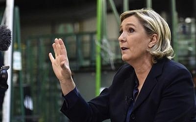 France's Front National (FN) far-right party's President and presidential candidate for the 2017 election Marine Le Pen gestures while speaking to a journalist at the Fermap manufacturing factory in Forbach, eastern France, on January 18, 2017. (AFP PHOTO / PATRICK HERTZOG)