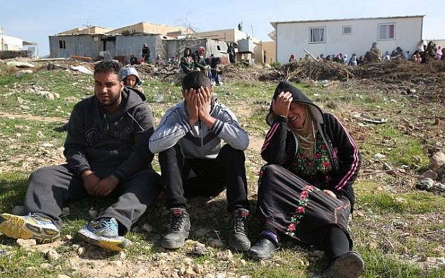 Bedouins cry following the destruction of houses on January 18, 2017 in the Bedouin village of Umm al-Hiran. (AFP/ MENAHEM KAHANA)
